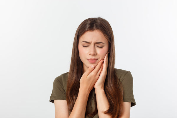 What Causes Sensitive Teeth, and How Can It Be Treated? - SprinJene
