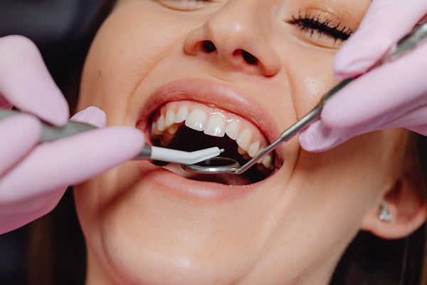 Woman at dentist for bleeding gums