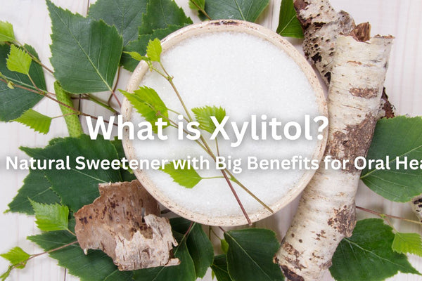 What is Xylitol? The Natural Sweetener with Big Benefits for Oral Health. Background features a bowl of xylitol with some branches of birch trees and birch tree leaves